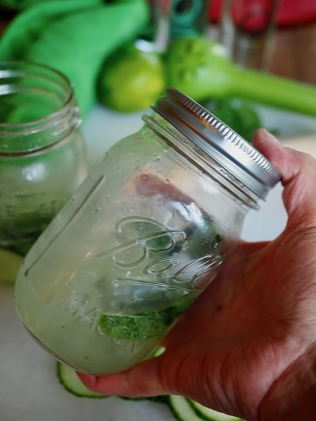 shaking cucumber cooler cocktail in ball jar | www.thefreshcooky.com