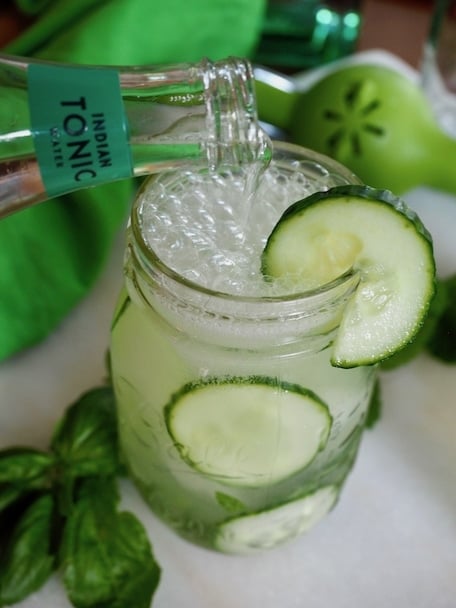 Pouring Tonic water in cucumber cooler cocktail | #thefreshcooky #cocktail #mocktail #mint #lime #basil #ginandtonic