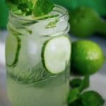 Spa water for adults! This 21+ Cucumber Cooler is so light, crisp and refreshing, filled with crunchy cucumbers, and the option of refreshing mint or earthy basil. Enjoy it after a hot afternoon playing outside or sipping with your girlfriends. #thefreshcooky #cucumbercooler #cocktail #mocktail #ginandtonic #mint #basil #lime