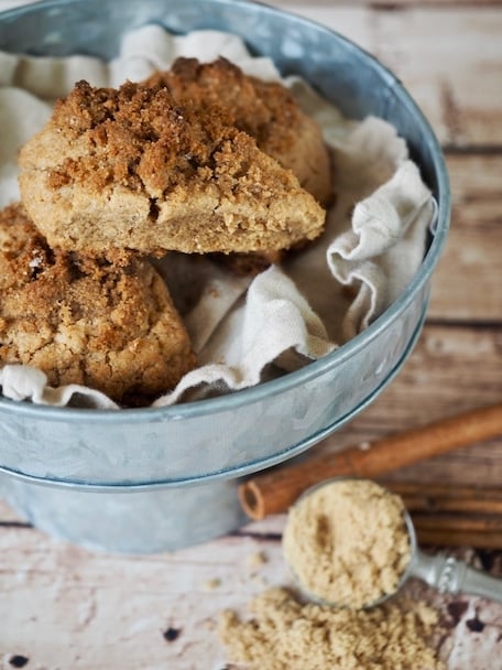 WOW, these simple Cinnamon Crunch Scones are a buttery, tender whole-grain, cream scones that are full of sweet cinnamon flavor. The cinnamon crumb crunch topping is the best part! From start to finish an hour tops. #thefreshcooky #scones #cinnamonscones #crumbtopping #brownsugar #fallbaking #recipe #brunch