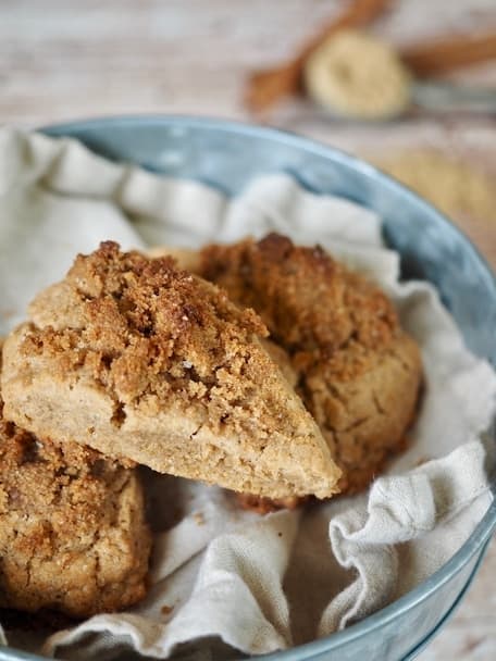 These Cinnamon Crunch Scones are a buttery, tender whole-grain, cream scones that are full of sweet cinnamon flavor and not the least bit dry. The Cinnamon Crumb Crunch topping is the best part! Perfect for a morning tea, breakfast or brunch or an afterschool snack! #thefreshcooky #scones #cinnamonscones #crumbtopping #brownsugar #fallbaking #recipe