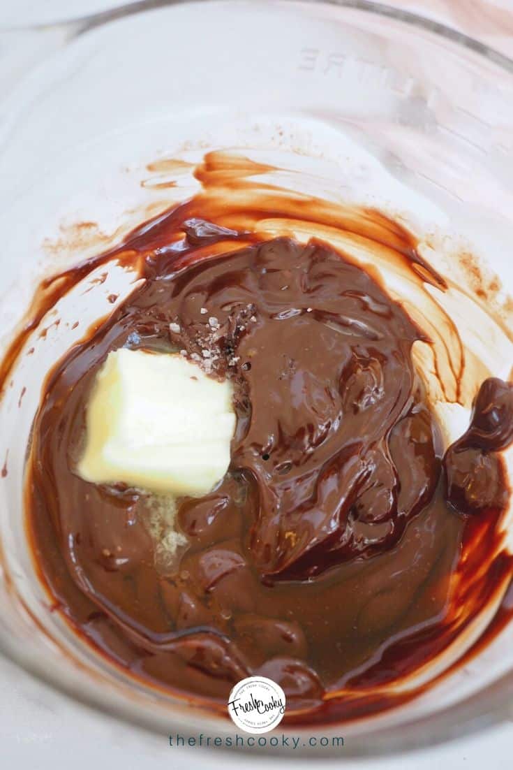 Bowl with a little salt, melted chocolate and cream and butter melting. 