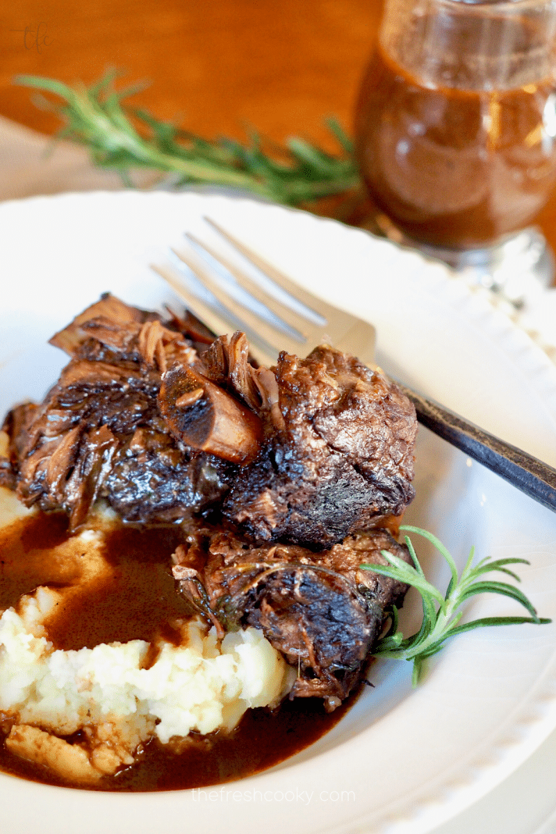 Italian Braised Short Ribs in bowl with rich gravy and mashed potatoes.