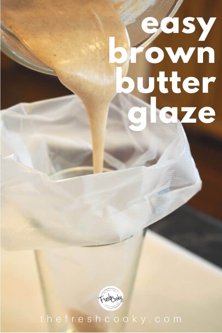 A tall glass with a piping bag folded over with brown butter glaze being poured inside of bag.