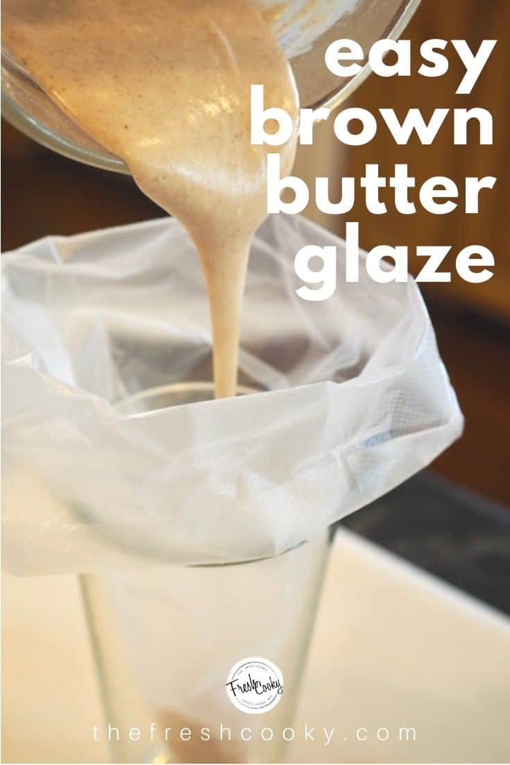 A tall glass with a piping bag folded over with brown butter glaze being poured inside of bag. 