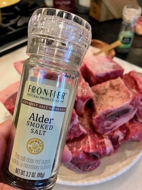 Smoked salt, going onto short ribs before braising.