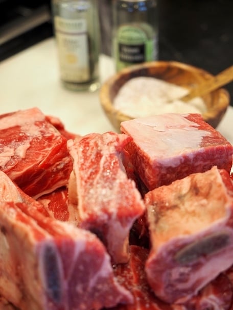 Salting beef short ribs for Italian short ribs recipe.