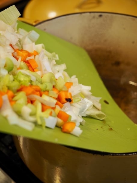 Adding leeks, celery and carrots to caramelize for Italian Short Ribs.
