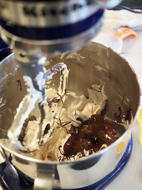 adding chocolate to egg mixture for Mini Chocolate French Silk Pies | www.thefreshcooky.com