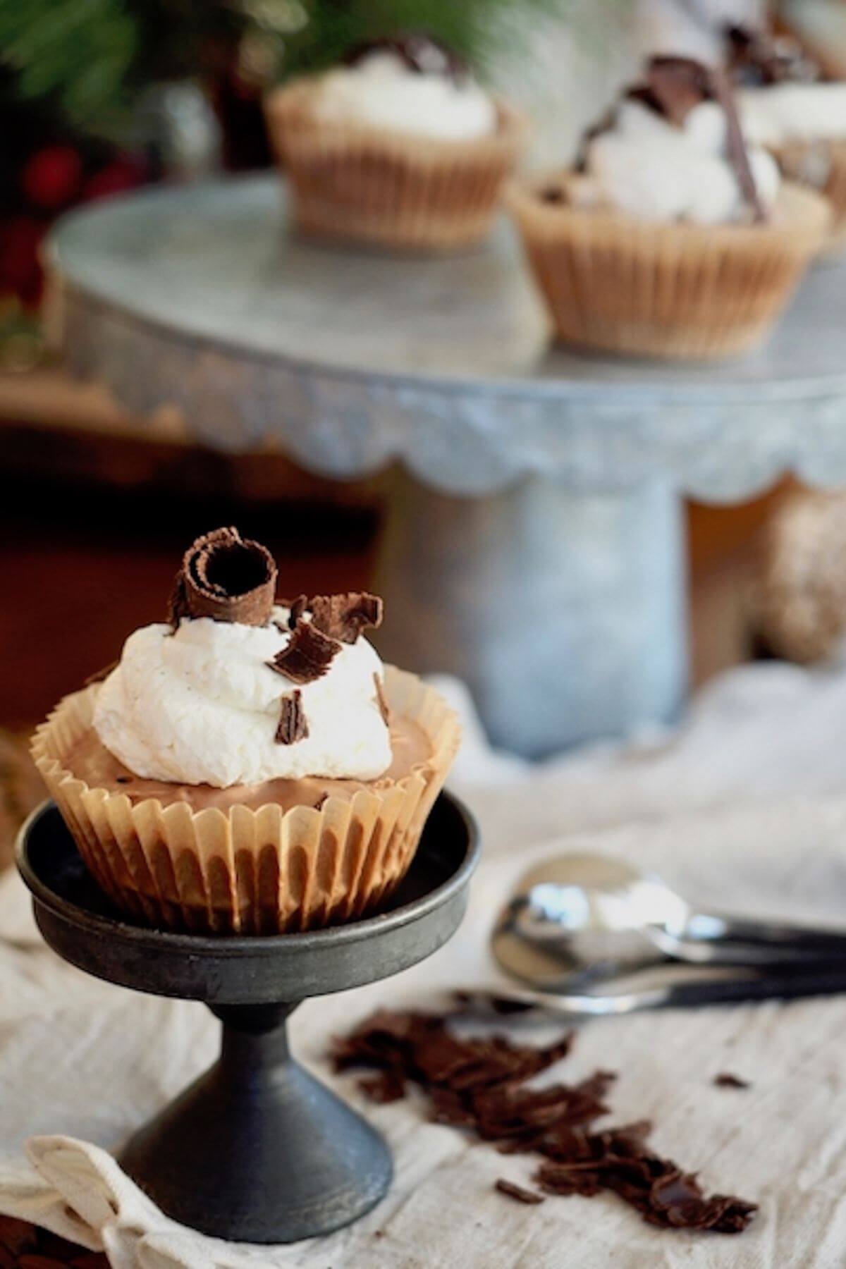 Mini chocolate pie on small pedestal for serving.