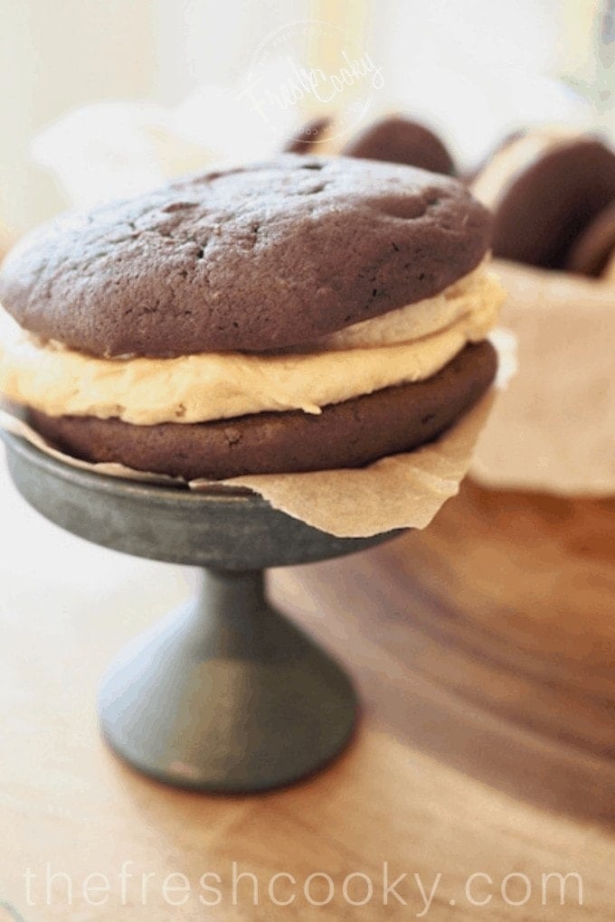 Picture of a Chocolate Fluffernutter Whoopie Pie on a pedestal. 