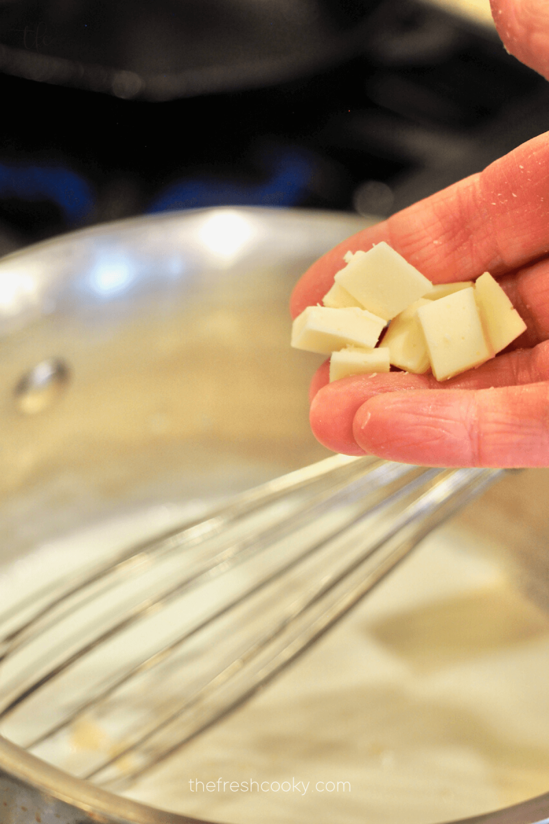 Adding chopped American White Cheese for Mexican Mozzarella Queso. 