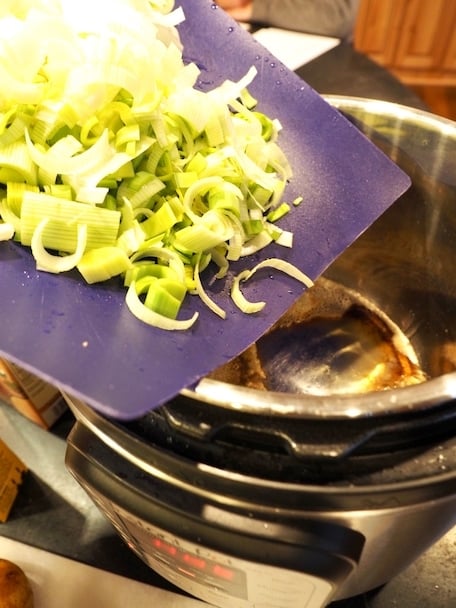 Tossing Leeks into Instant Pot.