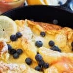 Dutch baby oven pancake in a cast iron pan.