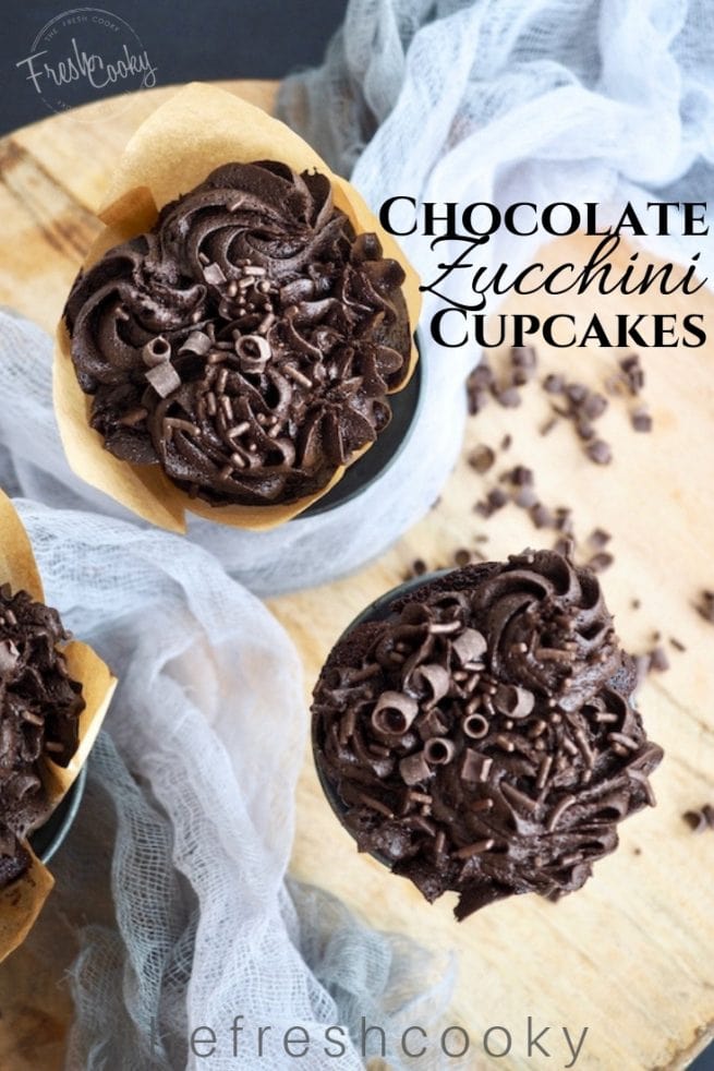 Picture of Chocolate Zucchini Cupcakes loaded with chocolate frosting, topping with chocolate curls | www.thefreshcooky.com