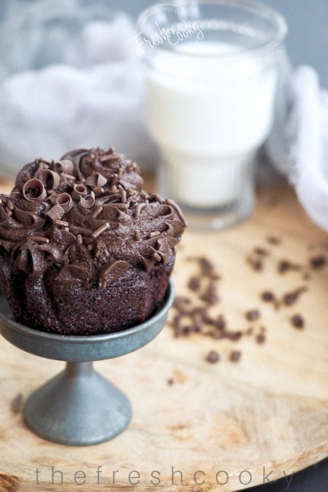 Picture of chocolate cupcake on stand with milk | www.thefreshcooky.com