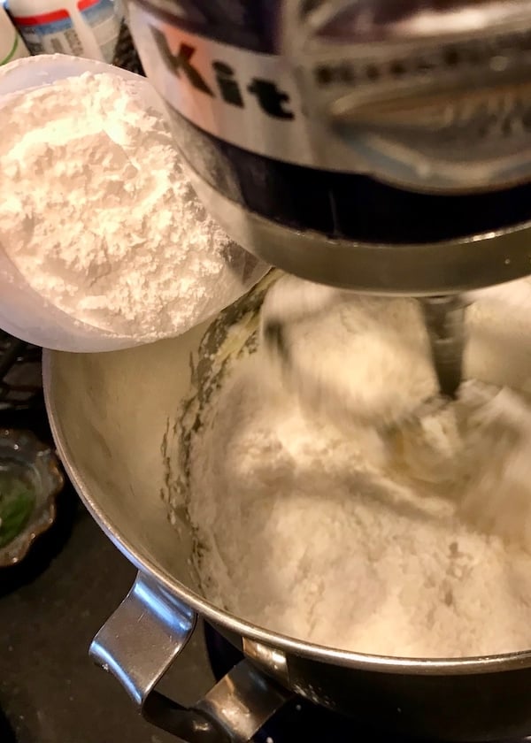 pouring in powdered sugar to frosting | www.thefreshcooky.com