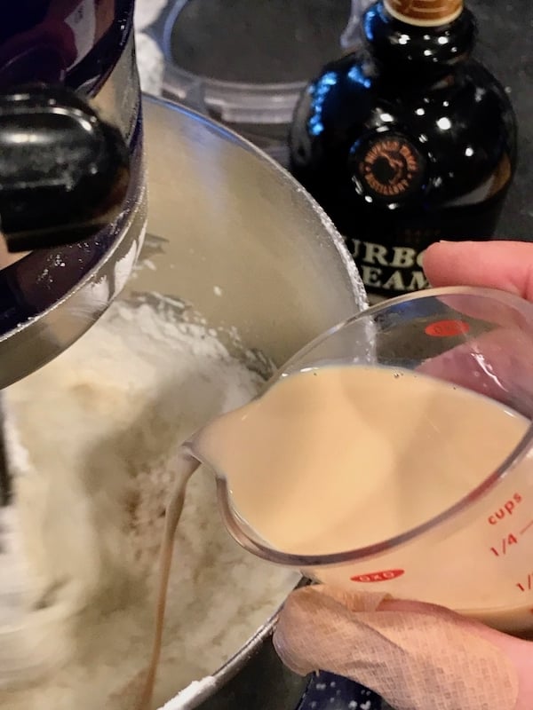 pouring in Irish cream for frosting | www.thefreshcooky.com