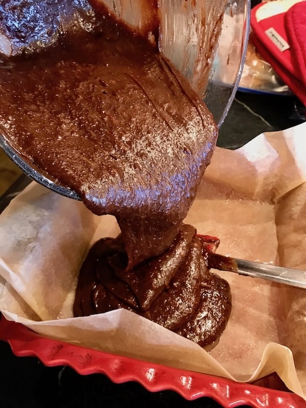 pouring brownie batter into pan | www.thefreshcooky.com