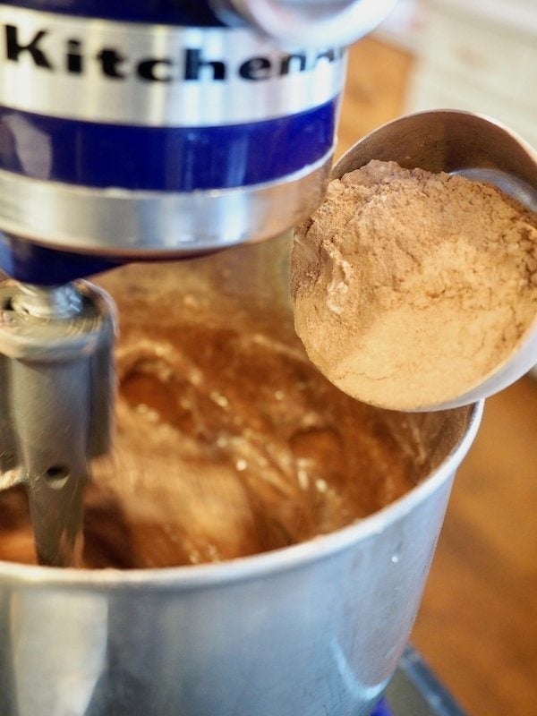 pouring in dry ingredients for chocolate cake | www.thefreshcooky.com