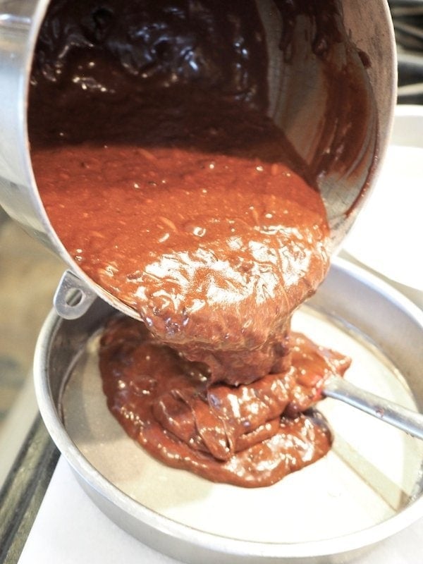 pouring chocolate cake batter into round pans | www.thefreshcooky.com