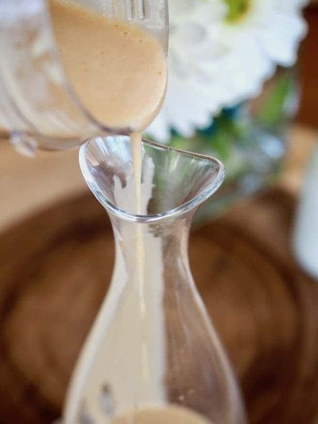pouring vinaigrette into jar | www.thefreshcooky.com
