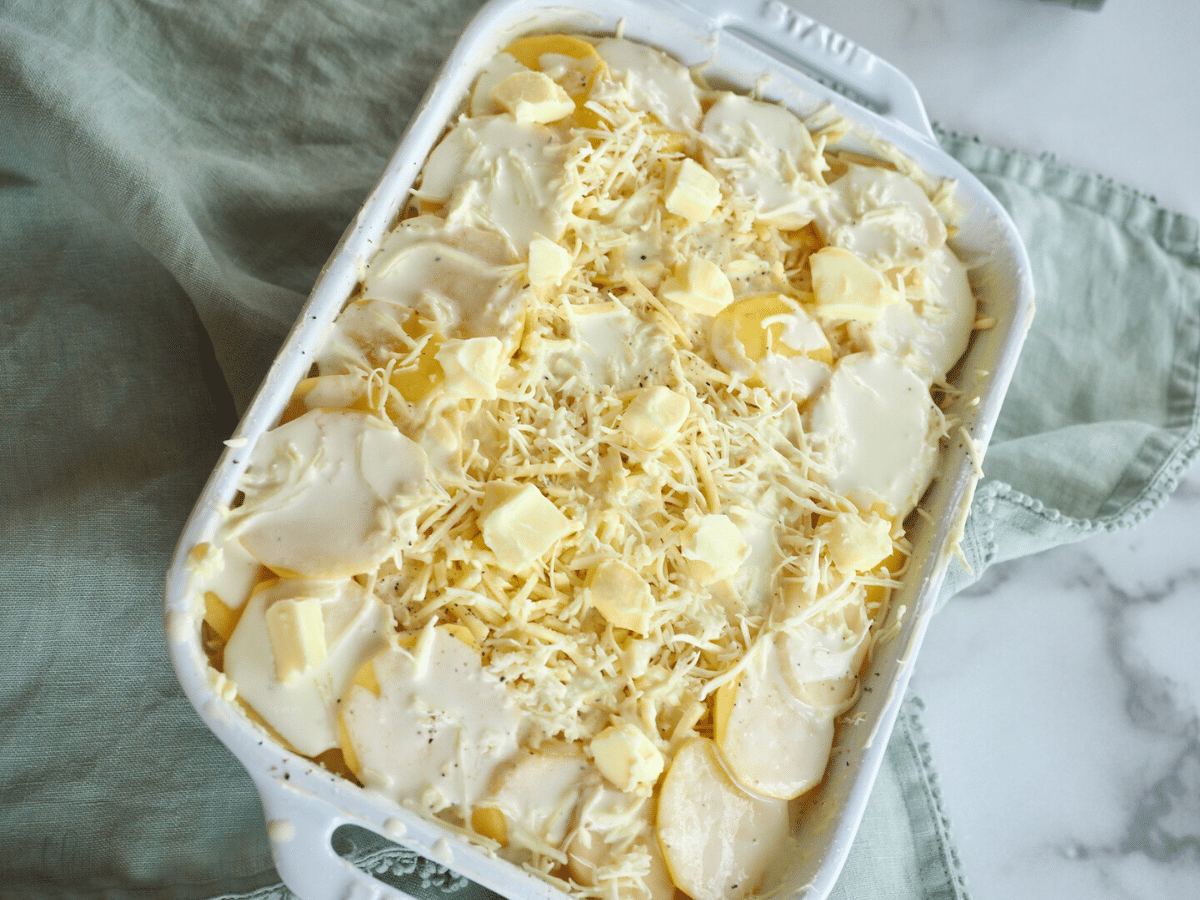 Layered Potatoes au gratin ready for oven.