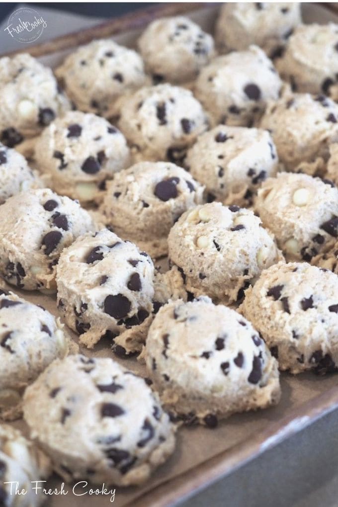 Cookie dough balls scooped close together for chilling. 