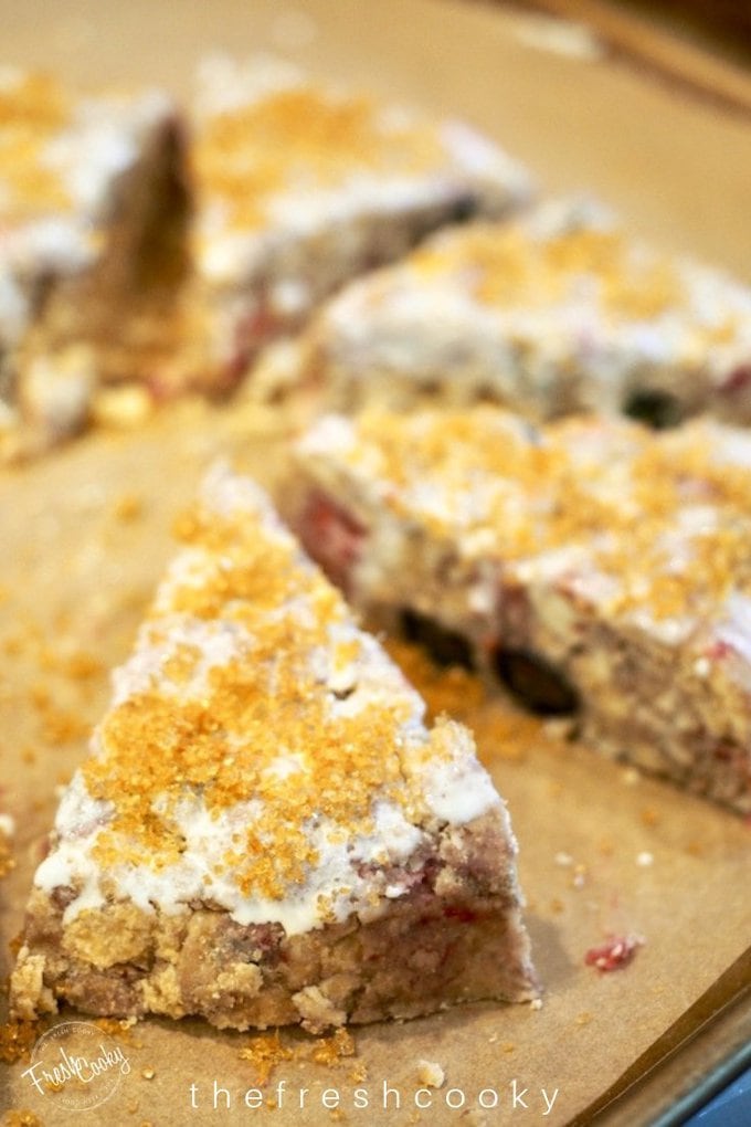 Scones brushed with cream and topped with sugar.