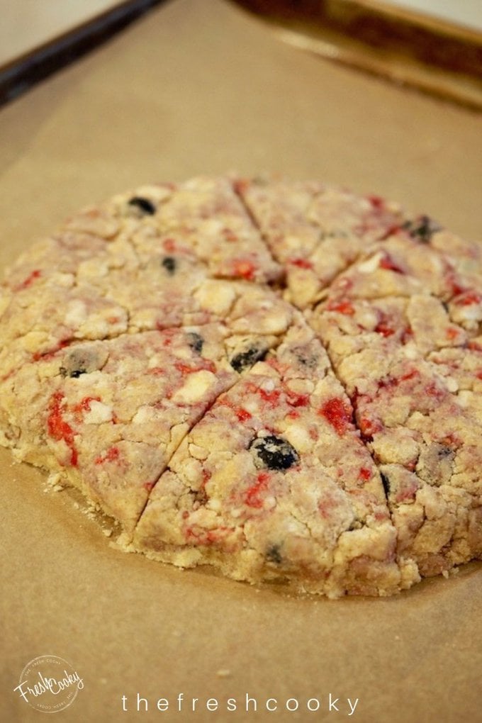 scone disc with fresh blueberries, raspberries in the batter, cut into wedges.  