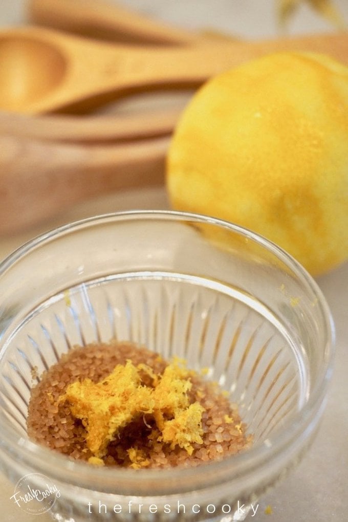 Bowl of demerera sugar with lemon zest for lemon sugar.  