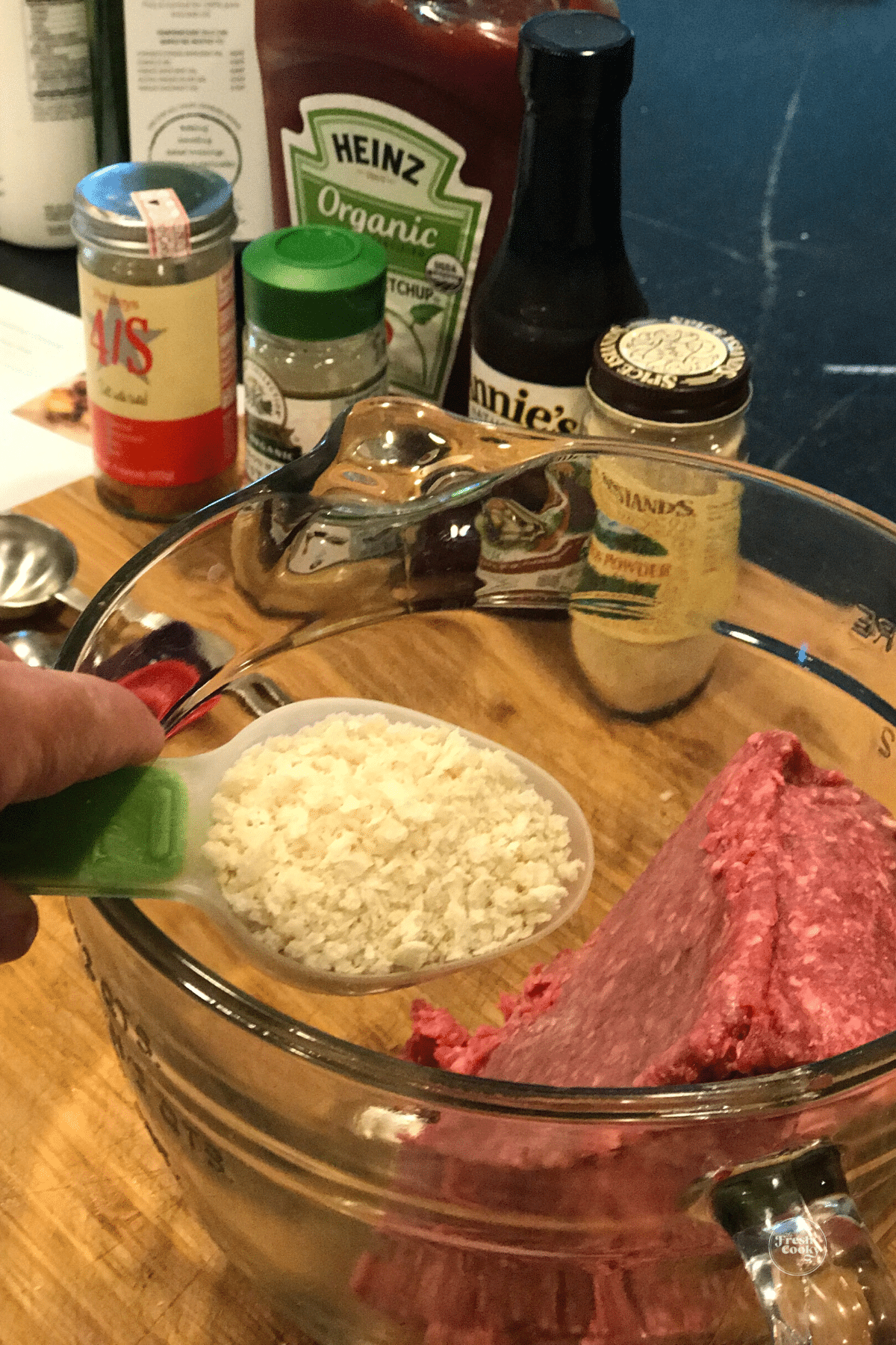 Adding panko to bison meat.