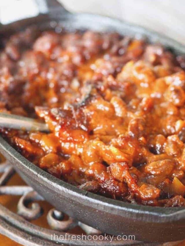 Cast Iron Pan filled with Cowboy baked beans with bacon.