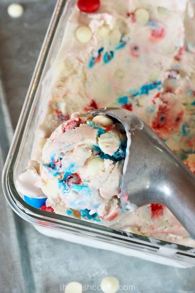 Top down shot of Red, White and Blue no churn ice cream with red, and blue m&m's along with white chocolate chips. 