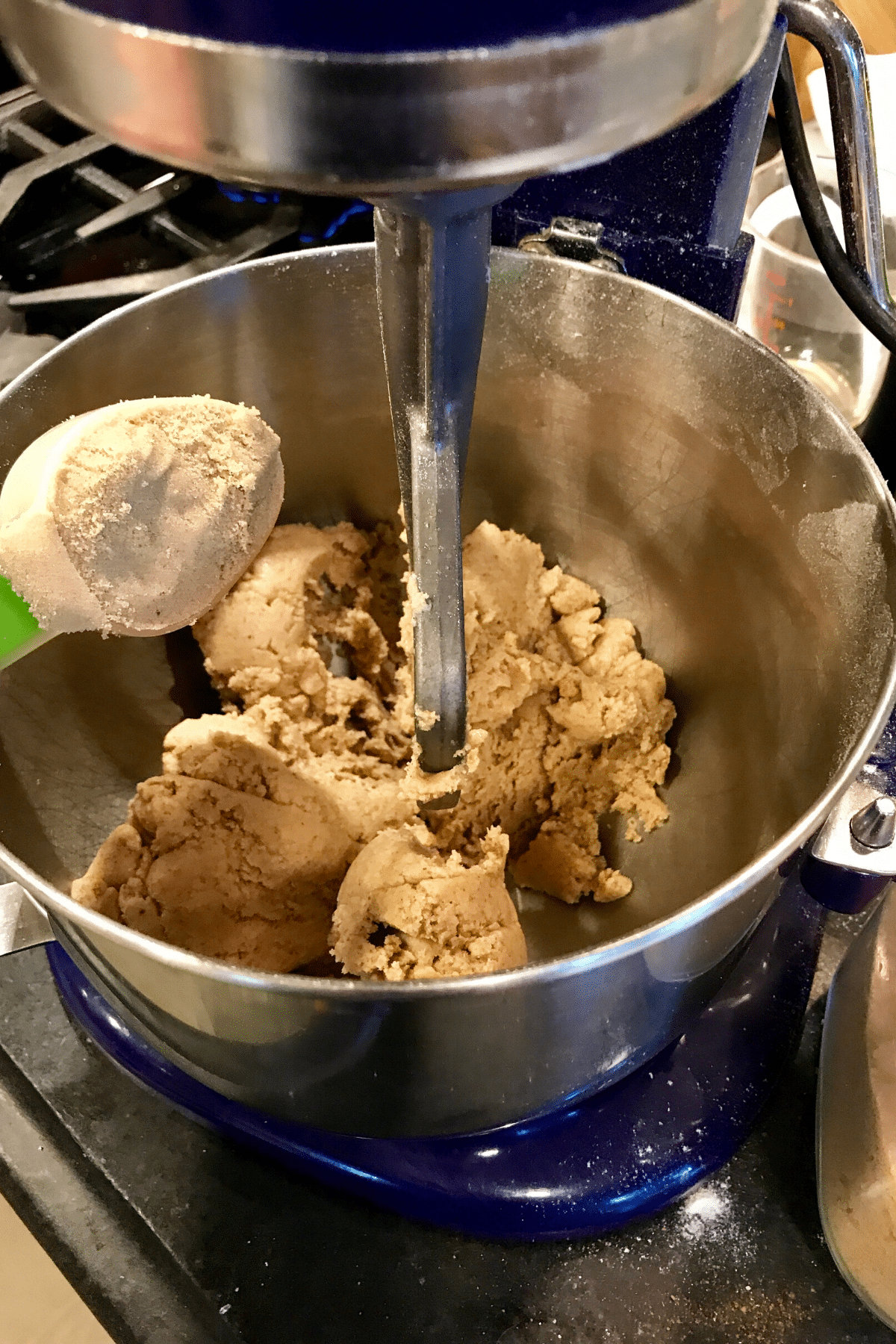Adding brown sugar to coffee cake mixture.