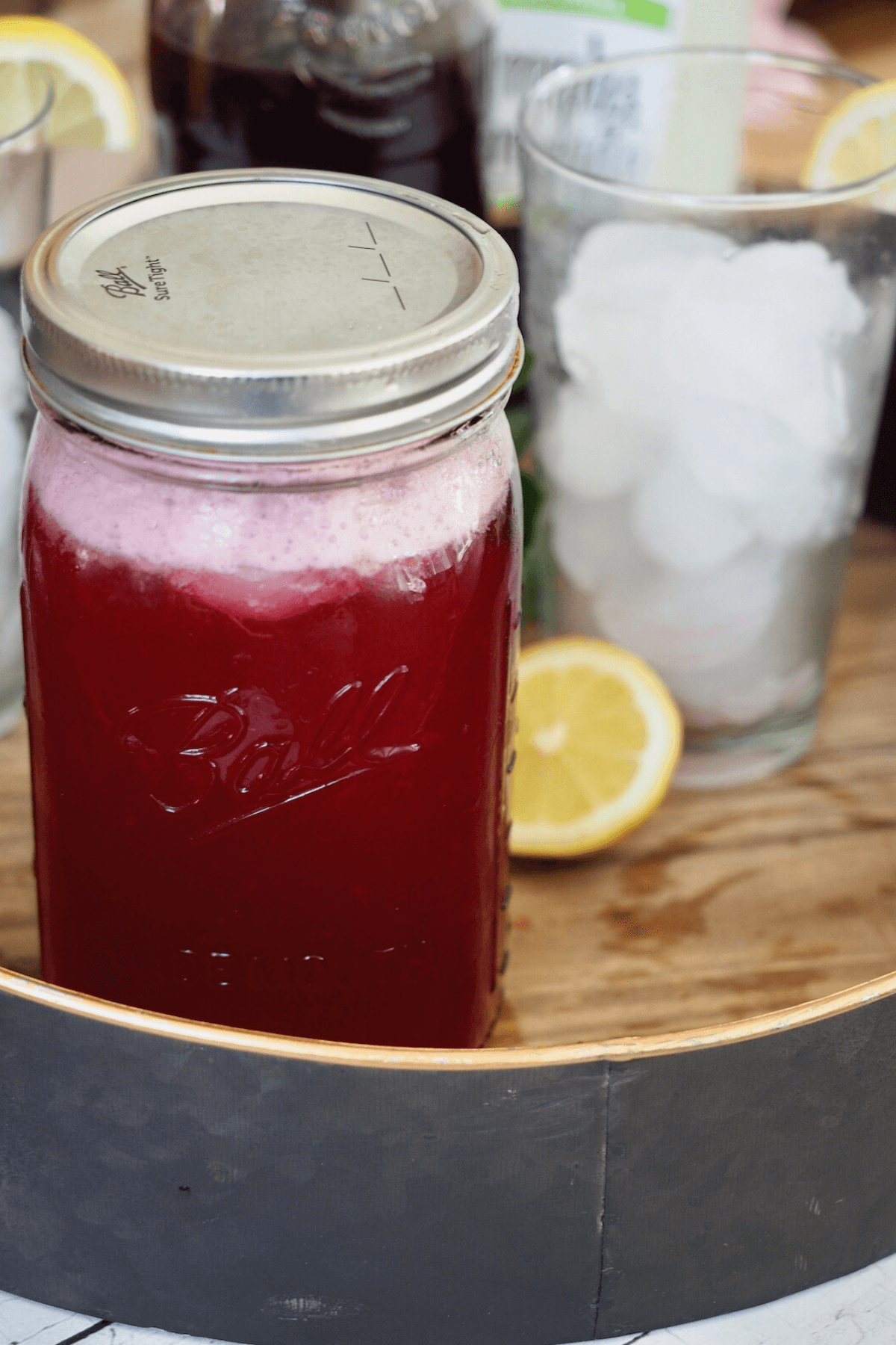 Passion tea lemonade in mason jar with ice after shaking.