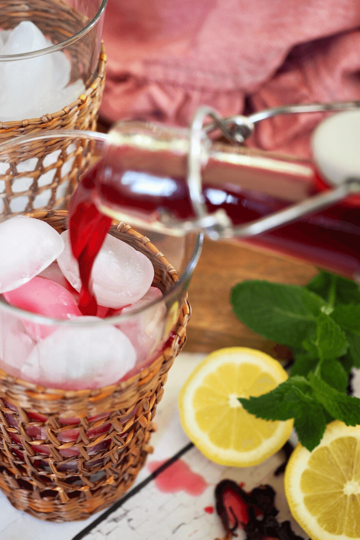 Adding Passion tea concentrate to glass. 