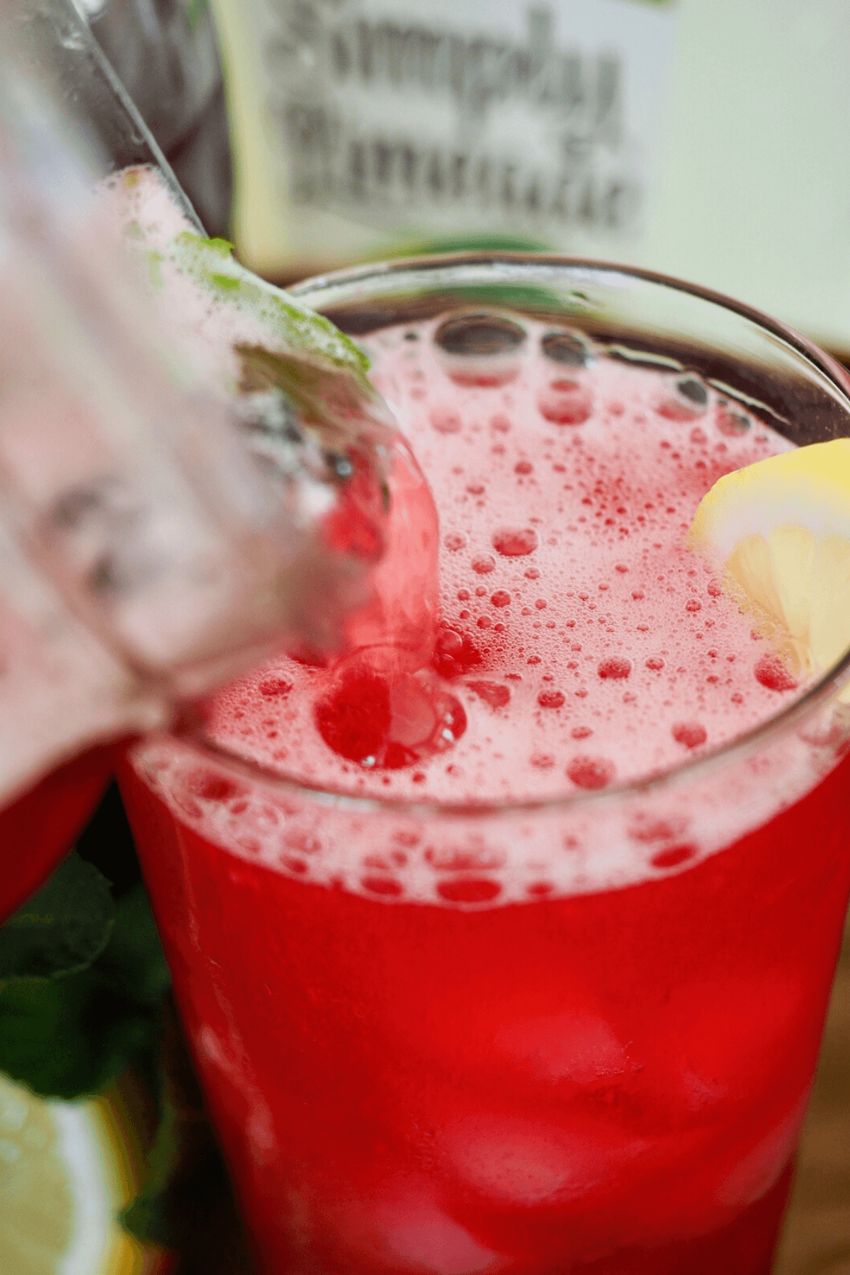 Frothy Tazo Passion Tea Lemonade Starbucks copycat being poured into a jar.