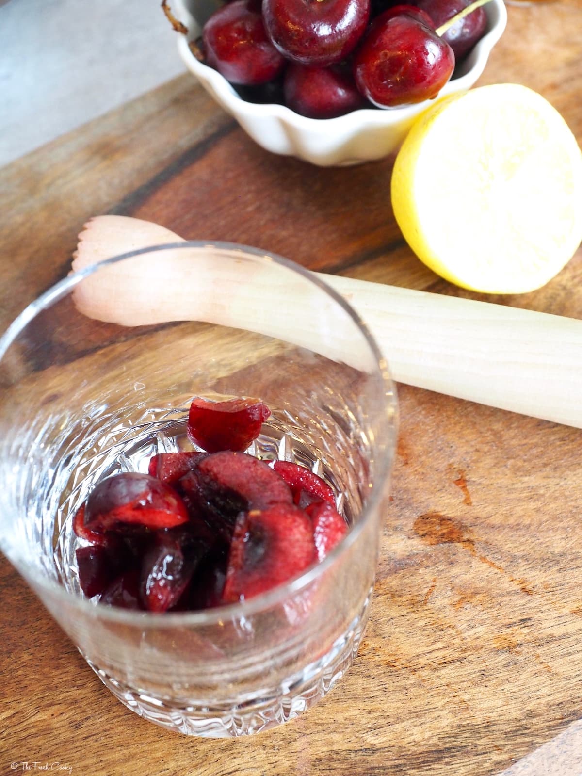 glass with chopped cherries inside