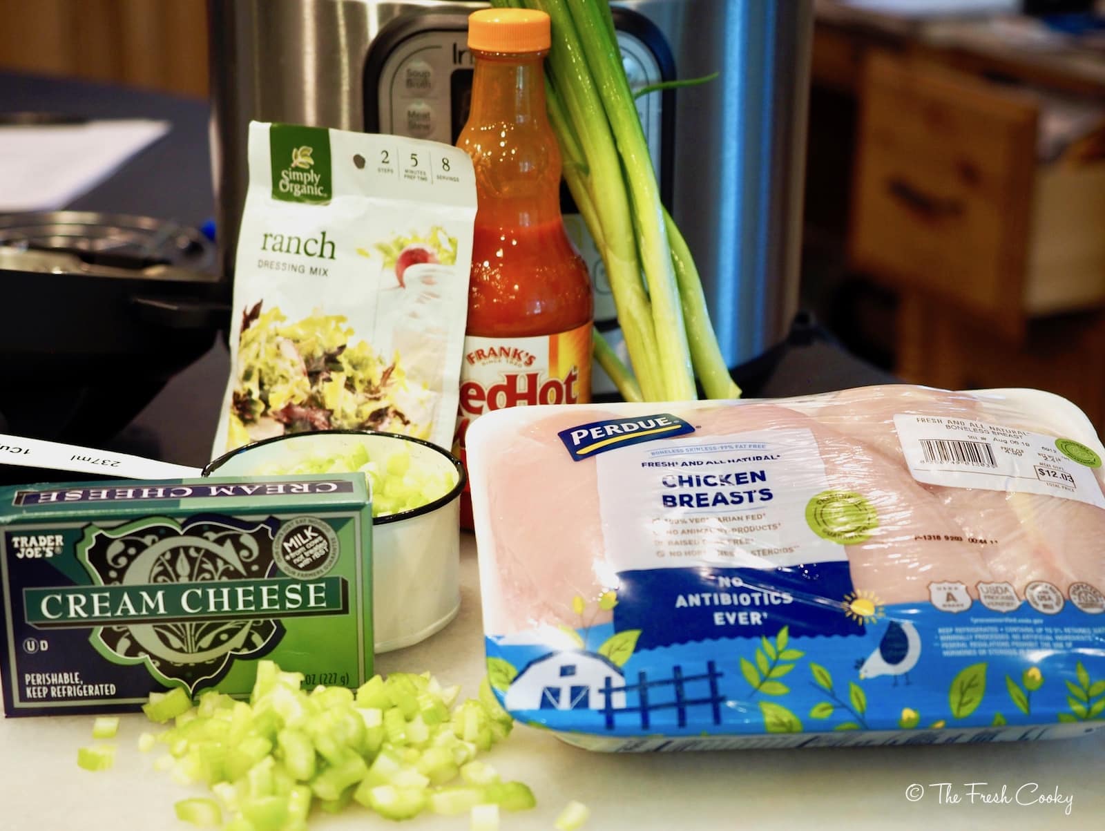 ingredients for buffalo chicken sliders. cream cheese, ranch dressing, celery, buffalo sauce and chicken breasts | thefreshcooky.com