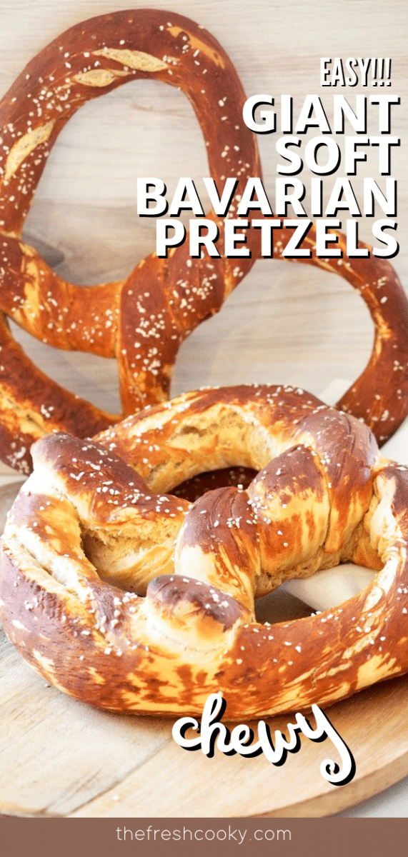 Long pin with image of two giant bavarian pretzels on a wooden platter.