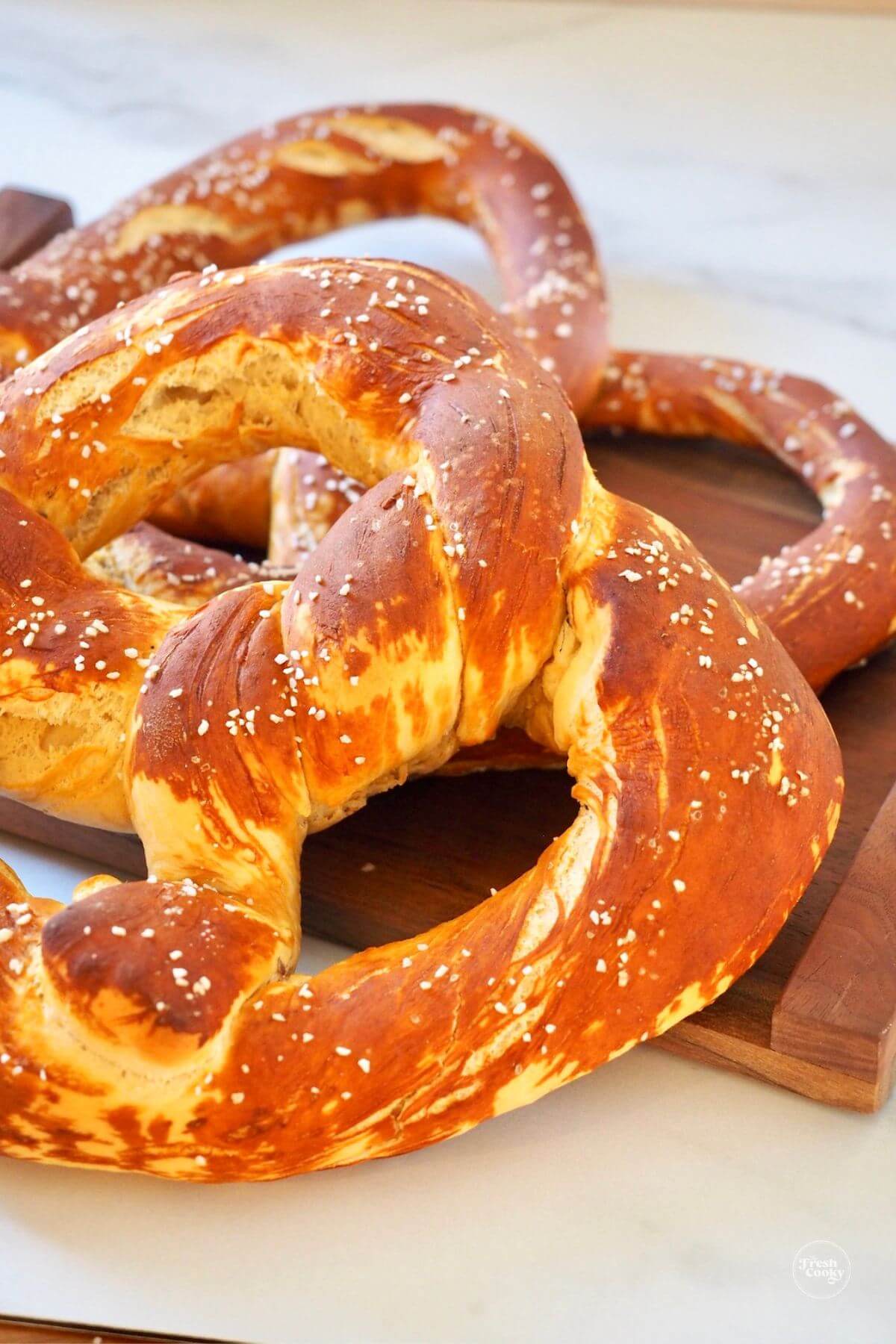 Close up of two large Bavarian pretzels after baking.