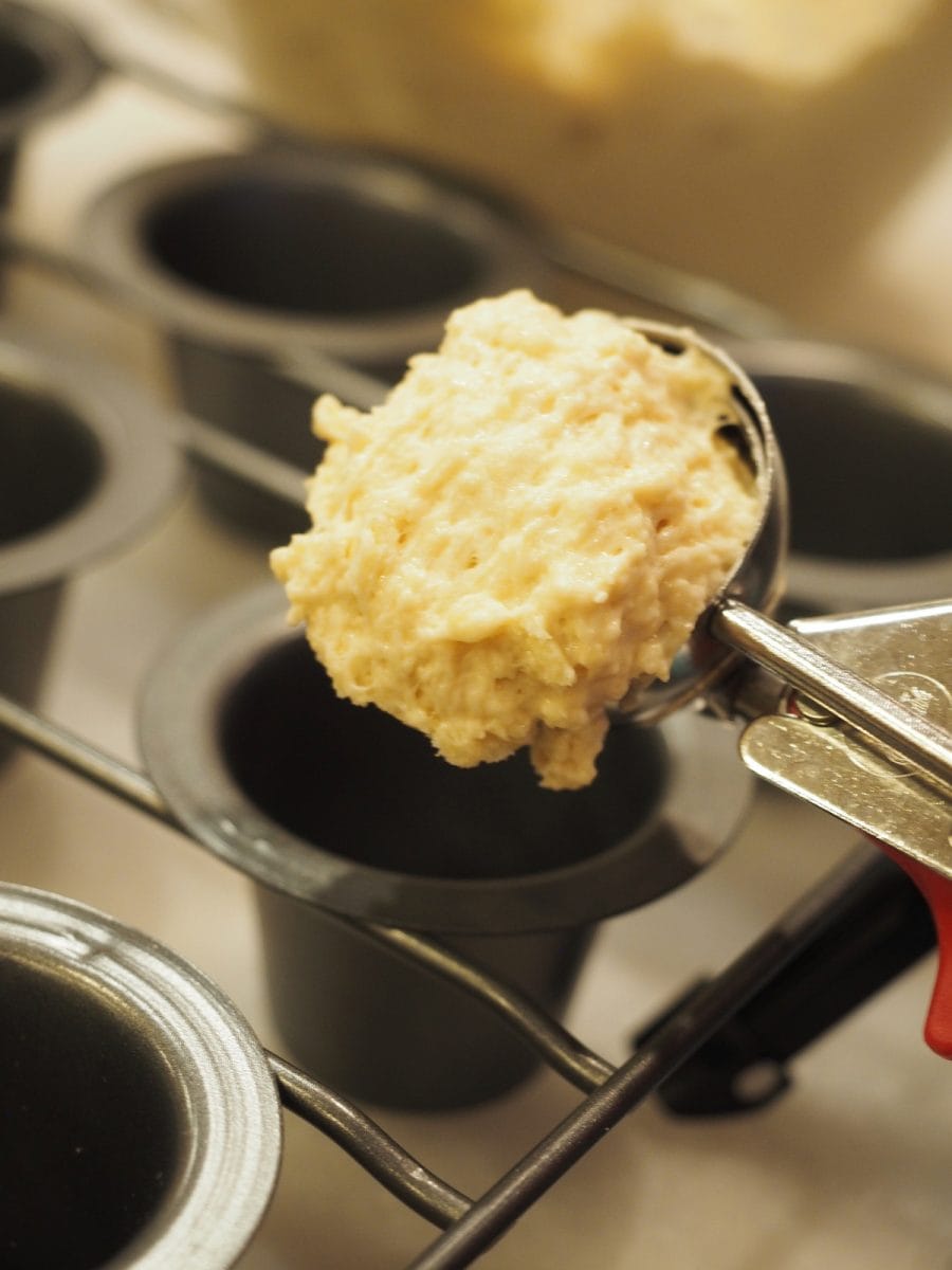 scoop of cheddar beer popover batter into popover tin | thefreshcooky.com