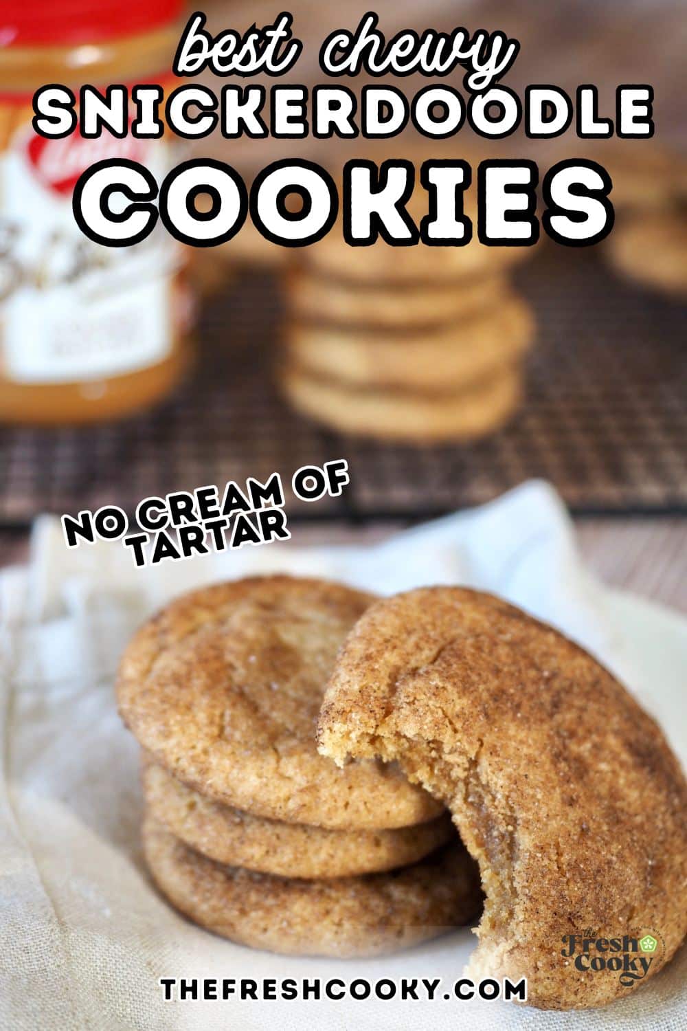 Stack of cookie butter snickerdoodles on a plate, with a bite taken out, for pinning.