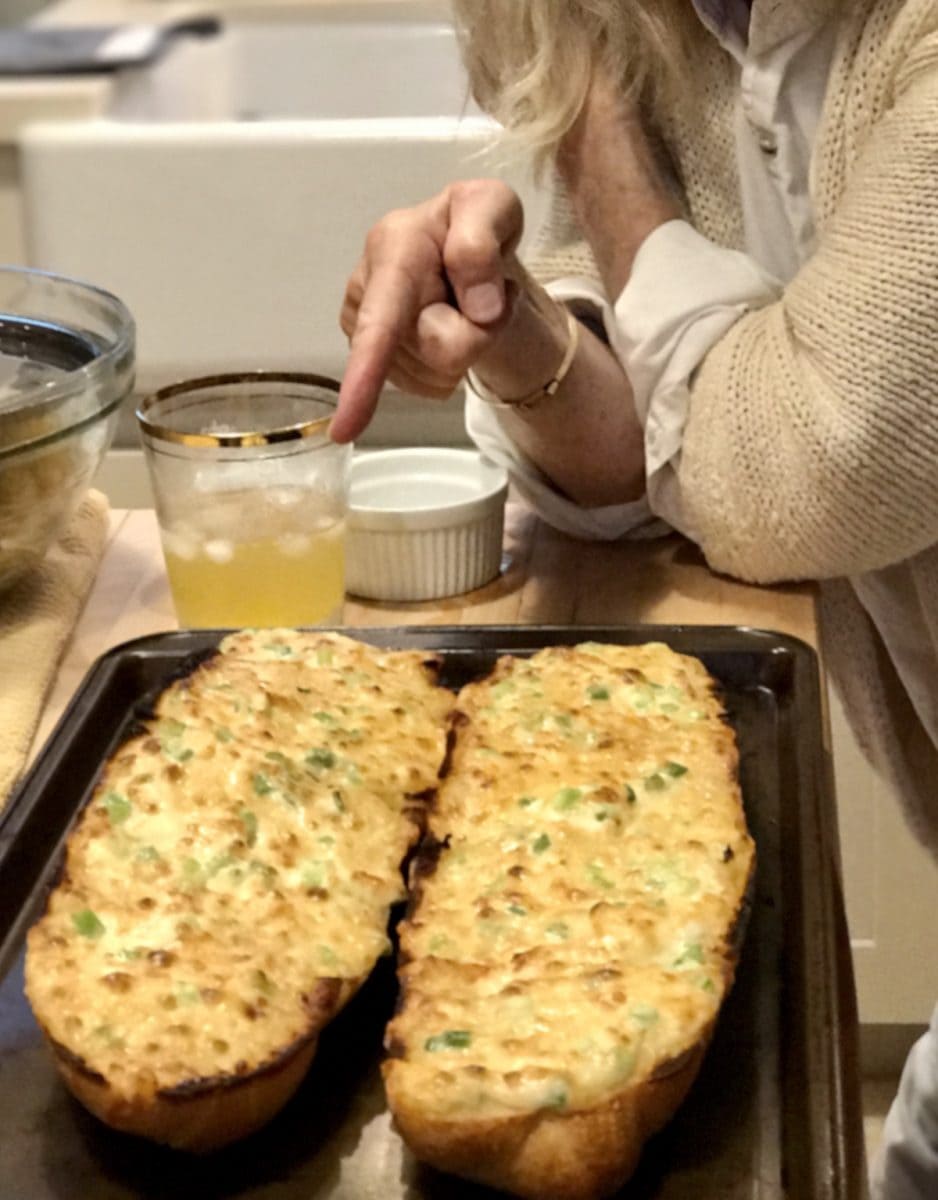 Liz pointing at her famous Liz Bread (cheesy garlic bread)| via @thefreshcooky