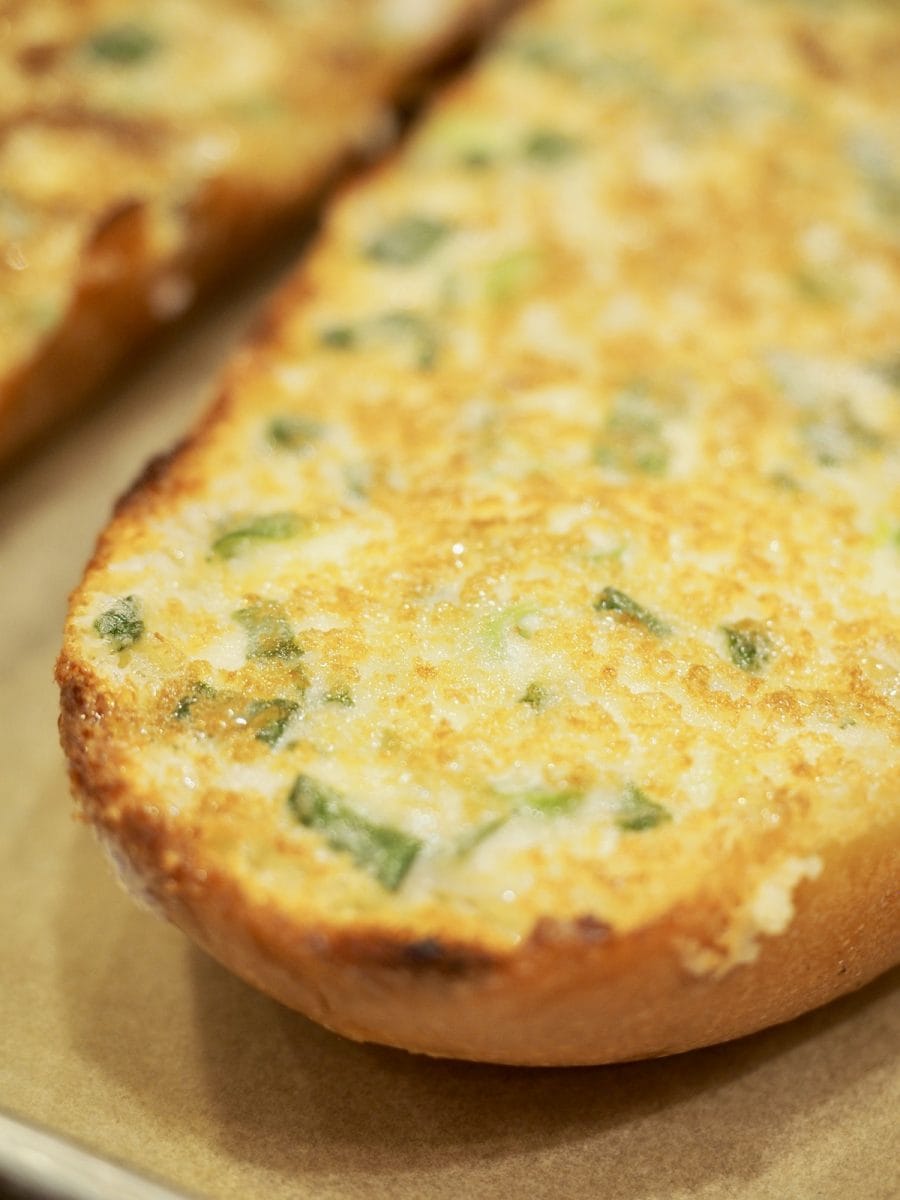 Fresh out of the oven cheesy bread, golden and bubbly with bits of green onions | thefreshcooky.com