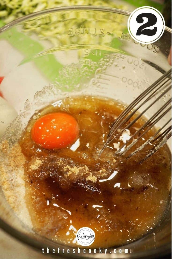 mixing bowl with oil, eggs, browned butter, sugars with whisk
