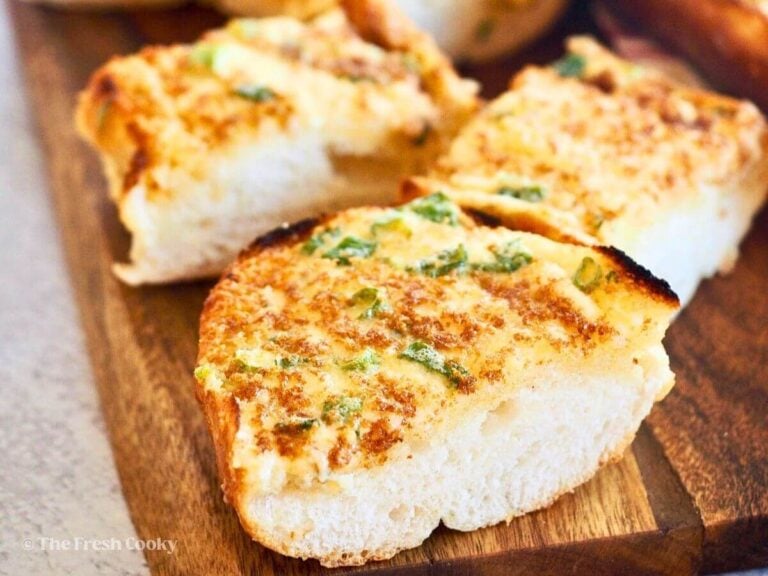 Sliced pieces of cheesy garlic bread.