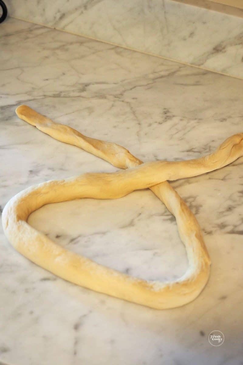 Step 1 to shaping a pretzel, Cross rope over near top.