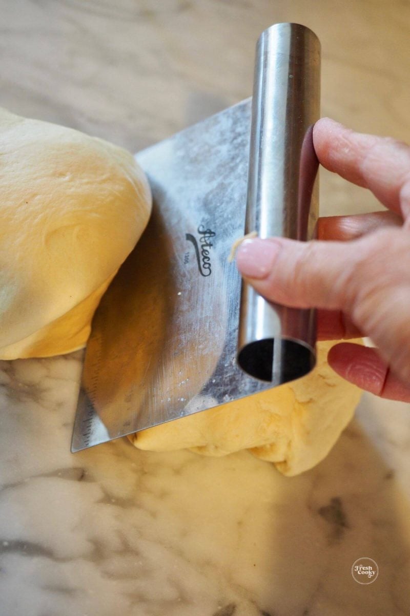 Dividing the dough in half. 